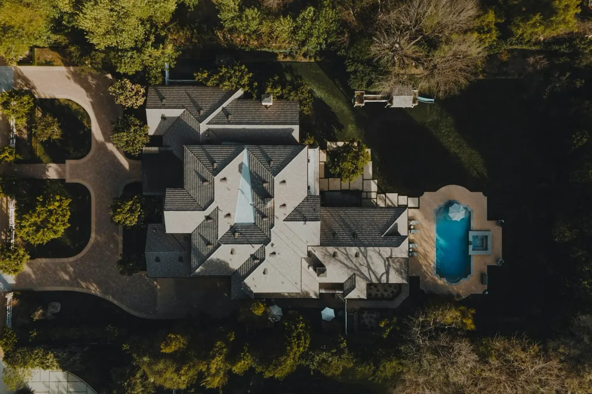 Aerial view of a luxury residential backyard with manicured lawn and modern irrigation zones